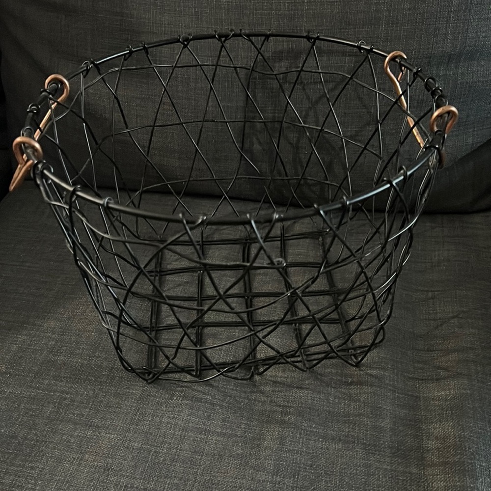 Black wicker basket with rose gold handles